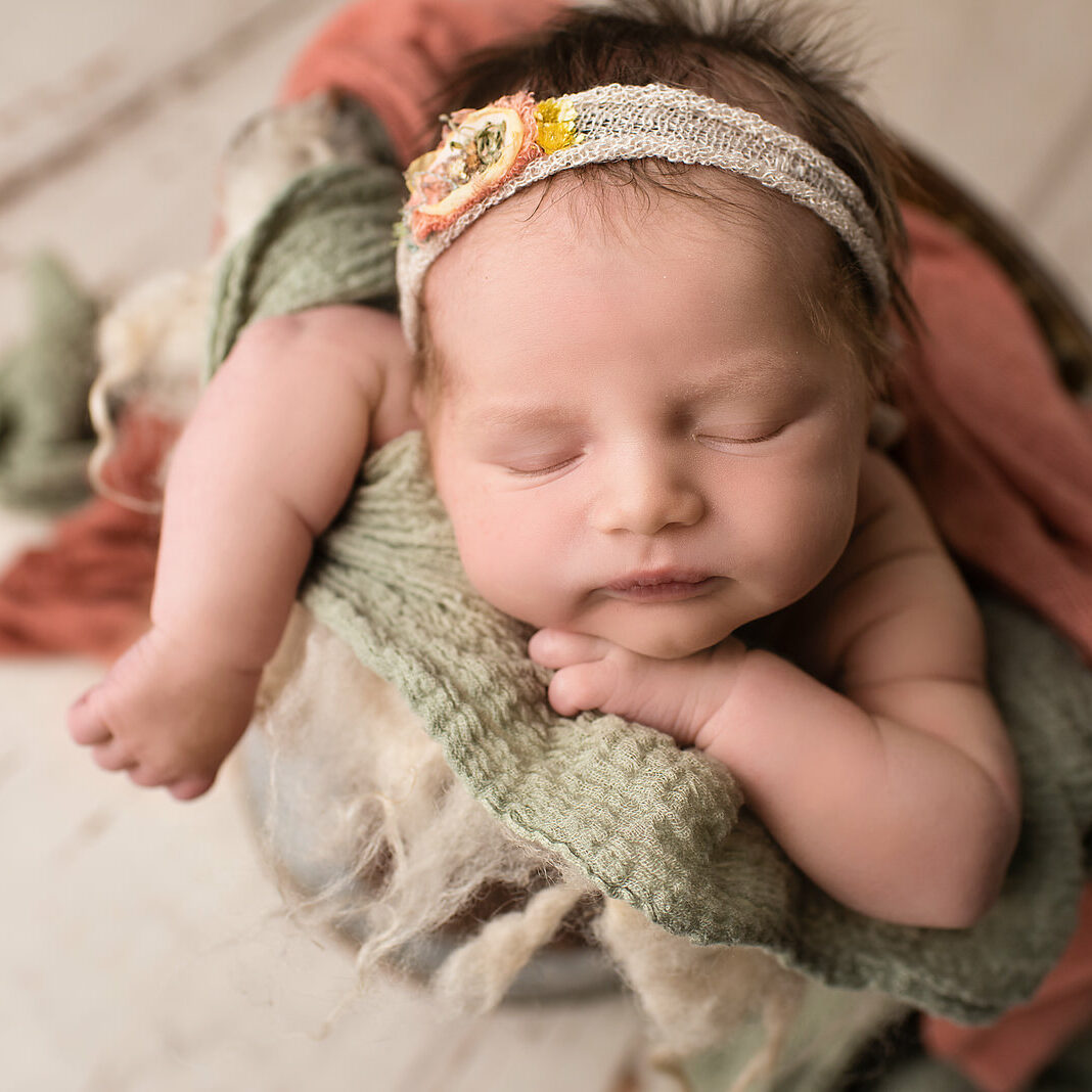 newborn girl poses